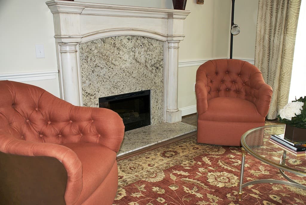 Fireplace after refinishing without topiaries via ashley-spencer.com